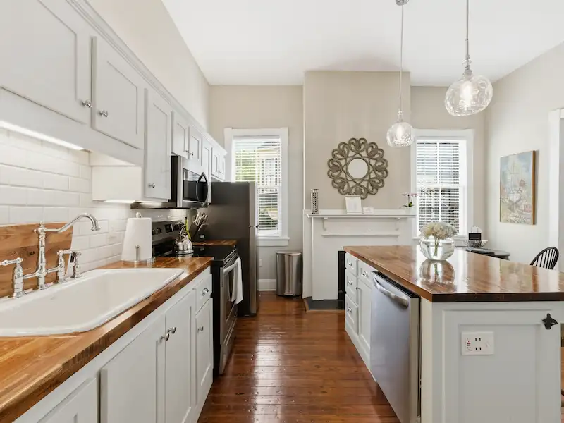 Suite 316A kitchen shaker cabinets with butcher block countertops â€” Victorian District vacation rental Savannah